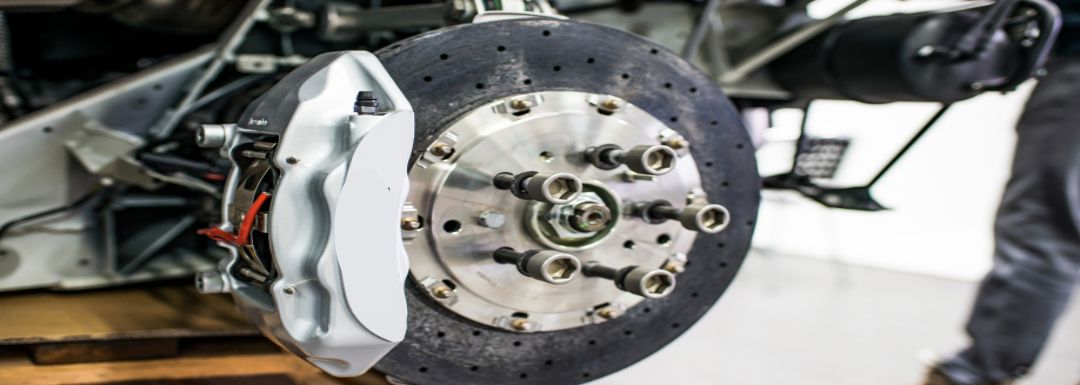 Close-up of a high-performance brake system undergoing repair.